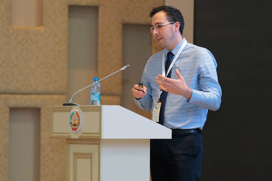 A person giving a speech at a podium AI-generated content may be incorrect.