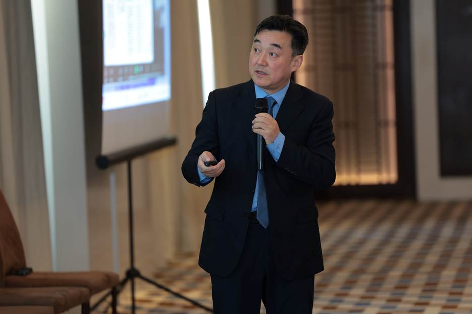 A person in a suit holding a microphone AI-generated content may be incorrect.